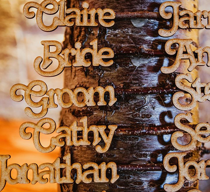 Tree trunk table plan finished with wooden names running up the side 