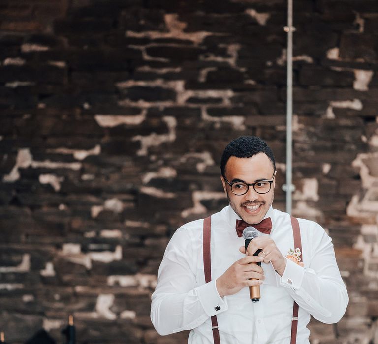 Groomsmen gives a speech at the wedding reception 