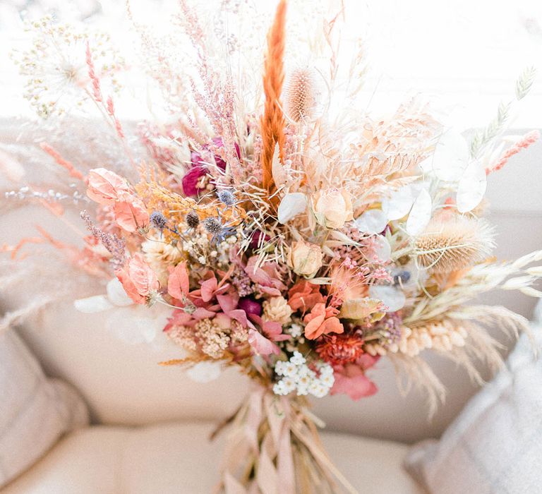 Dried floral arrangement for bridal bouquet complete with pampas grass and tied with silk ribbon 