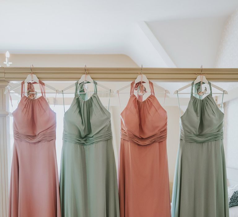 The bridesmaids' pastel pink and green wedding bridesmaid dresses to match the pastel pink and green wedding theme 