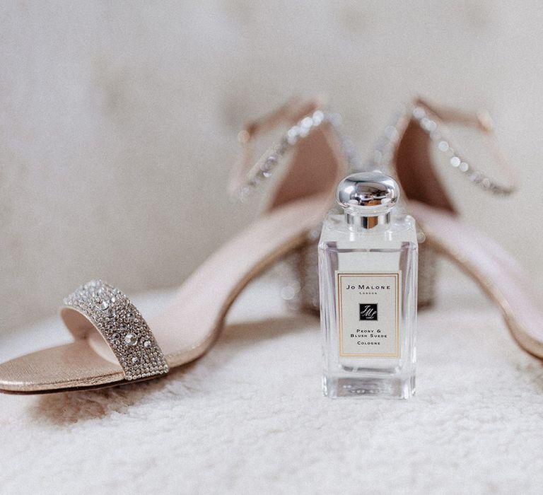 The bride's silver sparkly bejewelled wedding shoes with the Jo Malone Peony & Blush Suede perfume cologne 