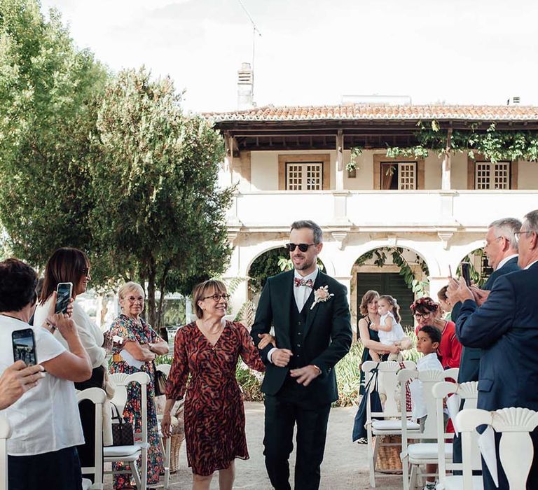 mother of the groom walking her son down the aisle at Porto Vineyards, Portugal