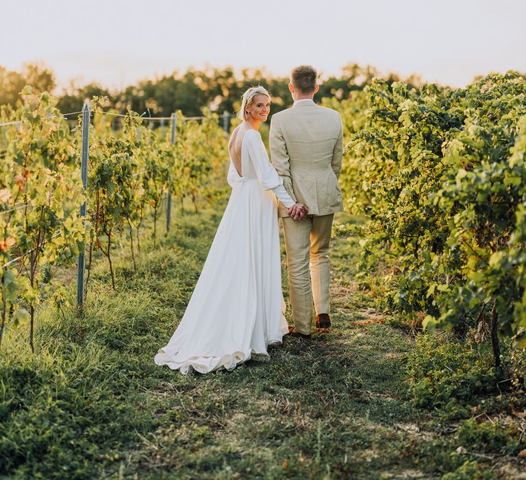 Bride and groom wedding photographs in a vineyard at Château de Malliac wedding venue, France