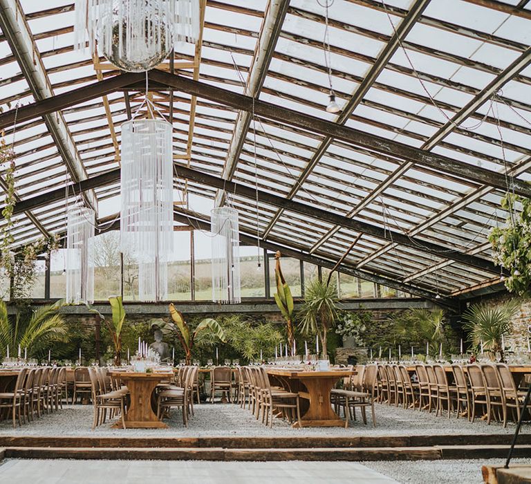 Glasshouse Anran Devon wedding venue with macrame chandelier lighting 