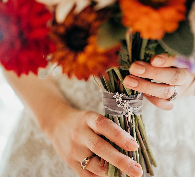 Bouquet for bride with sheer ribbon and silver charm 