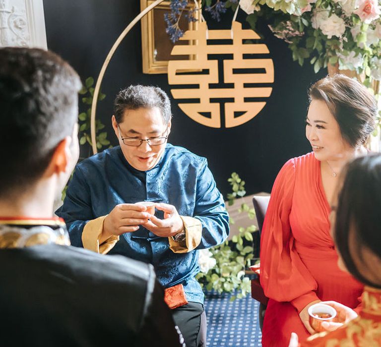 Traditional Chinese Tea Ceremony as the bride and groom give tea to the bride's parents 