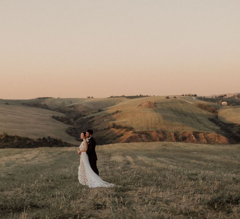 Golden hour wedding couple portrait with stunning views of Italy at villa wedding 