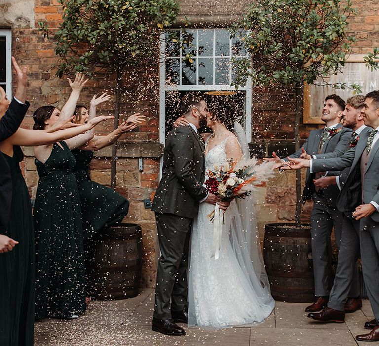 Confetti moment for the bride and groom at their industrial wedding in Derbyshire 