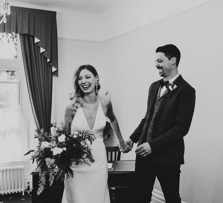 Black and white portrait of bride and groom just married