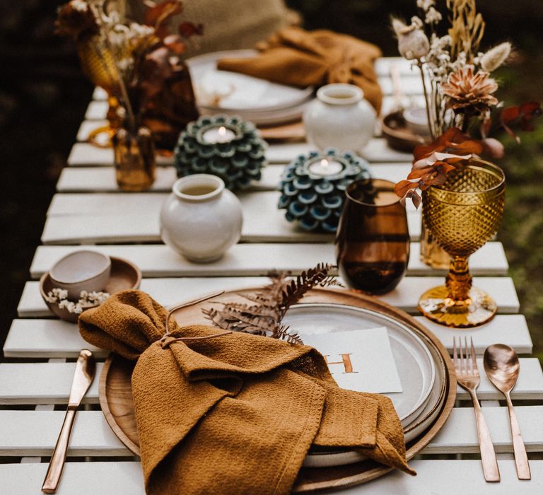 Burnt orange napkin tied with string