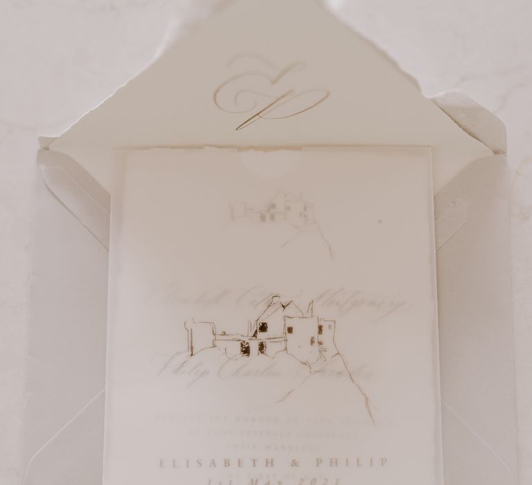 White wedding stationery with ink illustration of Dunluce Castle