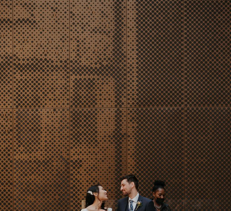 Bride and groom looking into each other's eyes, just married