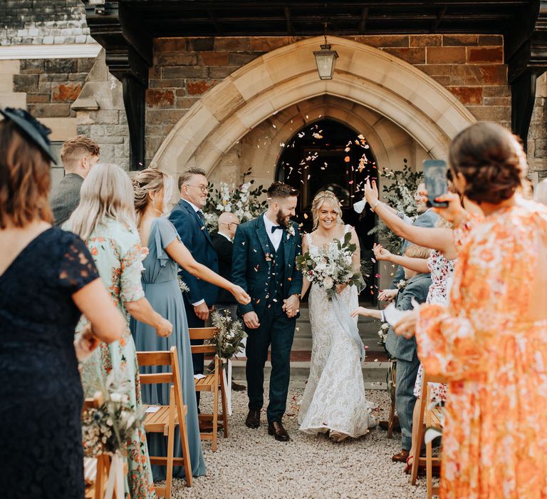 Confetti moment for bride and groom at Plas Dinam country house