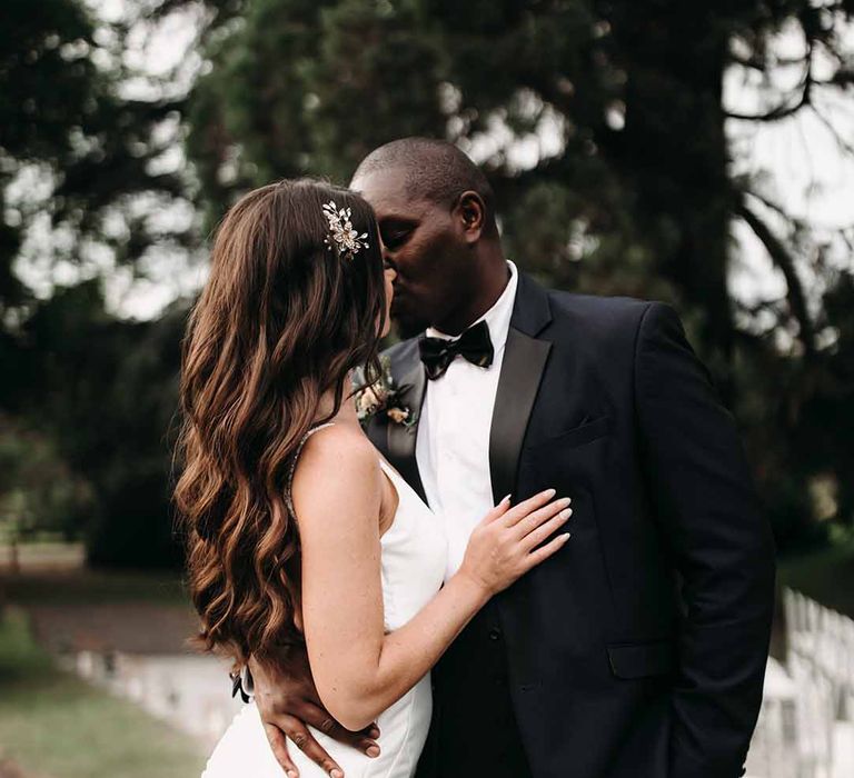 Bride & Groom kiss at their September wedding at Cefn Tilla Court