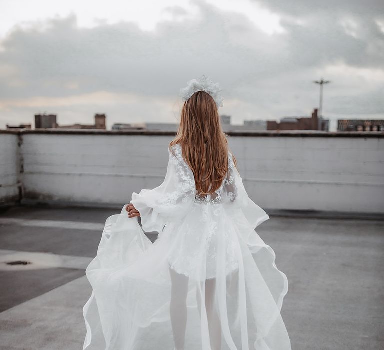 Double layer modern wedding dress by Daniel Chu with long sleeves and lace design 