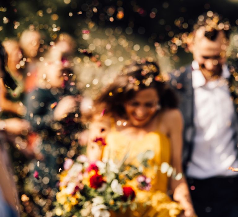 Bride & groom walk down the aisle after ceremony