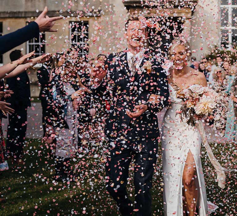 Bride and groom have their confetti exit at Elmore Court