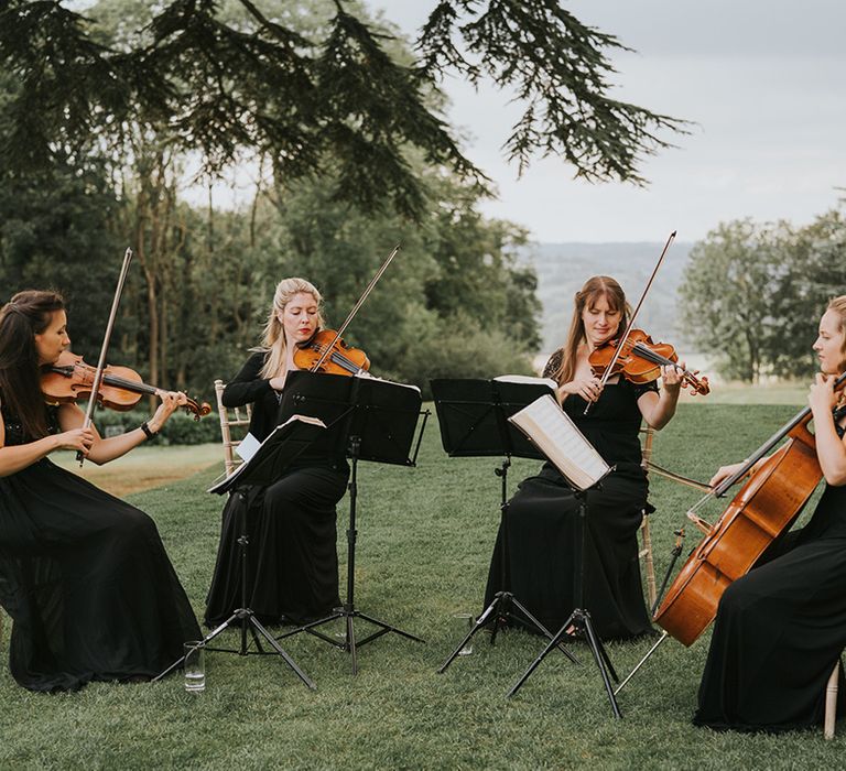 Live wedding band play outside for classic and traditional wedding 