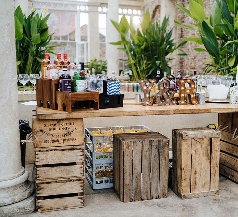 Wooden cocktail bar with rustic vibe complete with light up personalised initials 