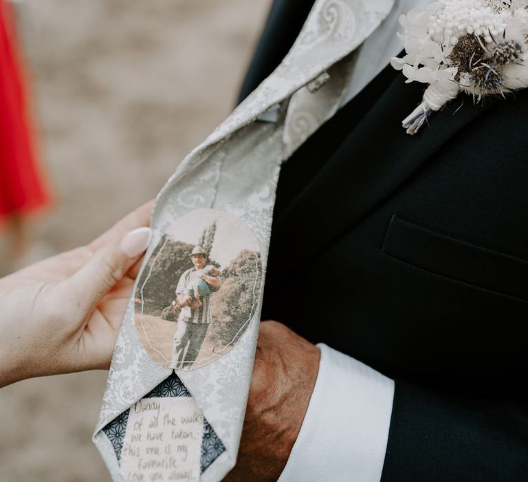 Father of the bride with white paisley tie with stitched photo and personalised message from the bride with white buttonhole 