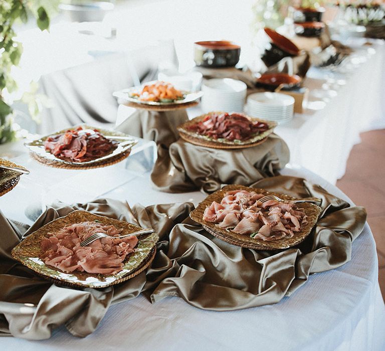 Buffet styled catering during outdoor Tuscan wedding reception