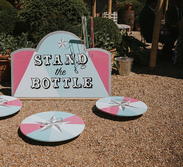 Stand the bottle wedding fairground games for entertainment at the fun fair theme wedding 