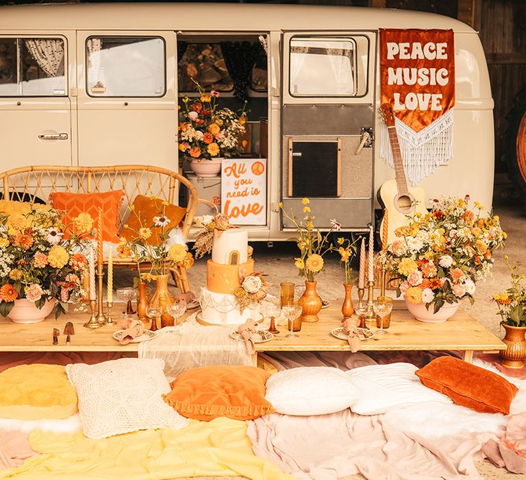 VW Campervan vintage wedding transport with orange theme wedding decor and tablescape with three tier wedding cake 