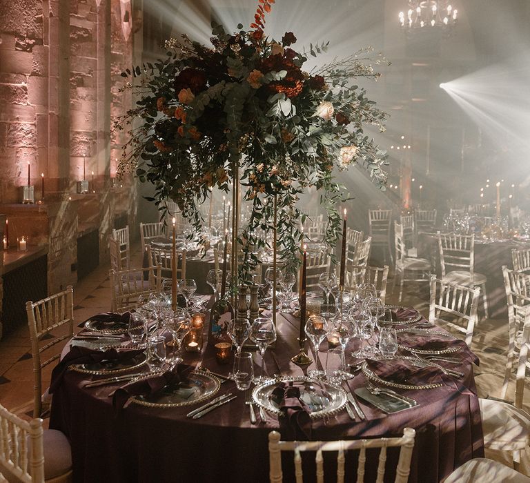 Tall flower wedding table centrepieces for winter wedding with deep red flowers 