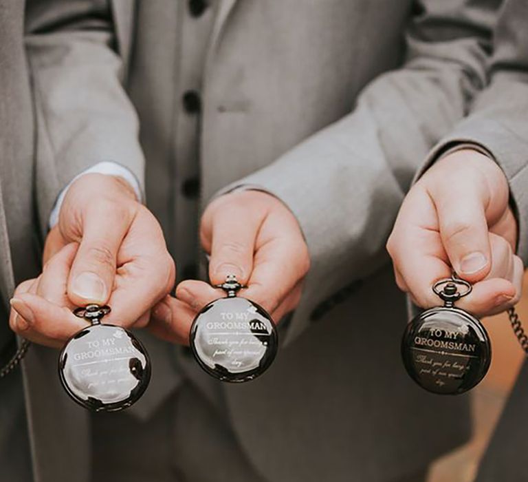 Groomsmen and groom with matching black personalised pocket watches for the wedding day by Poppy Carter Portraits