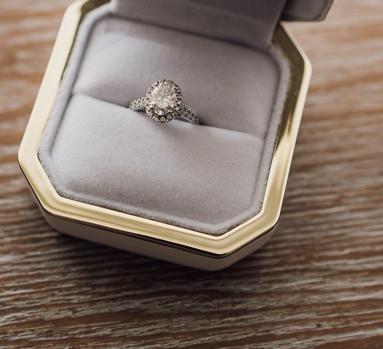 Oval diamond engagement ring with halo setting 