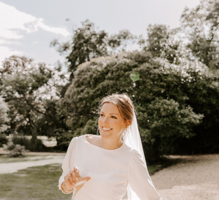 Gorgeous bride in bespoke wedding dress