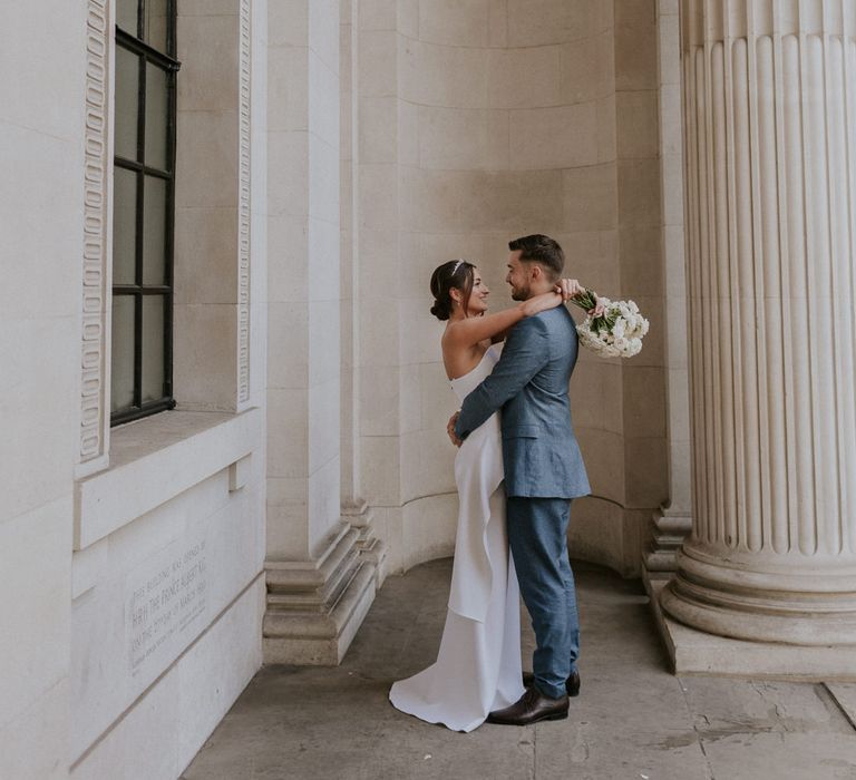 Bride and groom portrait with bride in Roland Mouret wedding dress 