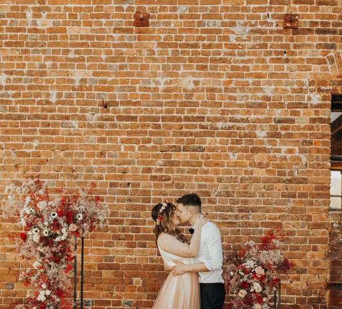 Bride and Groom kissing at Brickhouse Vineyard Wedding