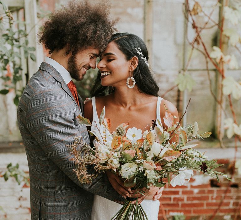 Bride and groom portrait by Lianne Gray Photography embracing 