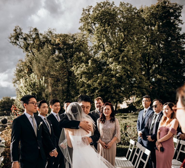 Father of the bride giving his daughter away 