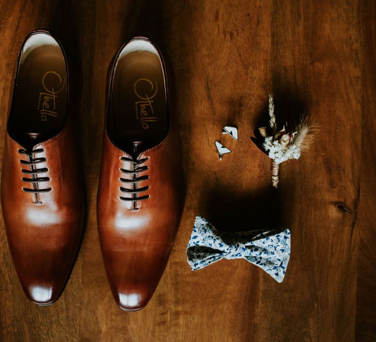 Grooms shoes, bow tie, cufflinks and buttonhole