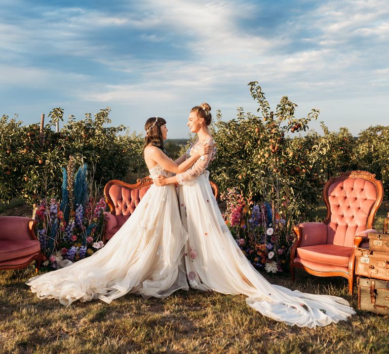 same sex brides in flower embroidered wedding dresses 