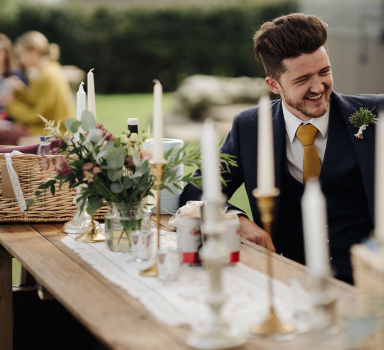 Wedding guest laughs at the bar 