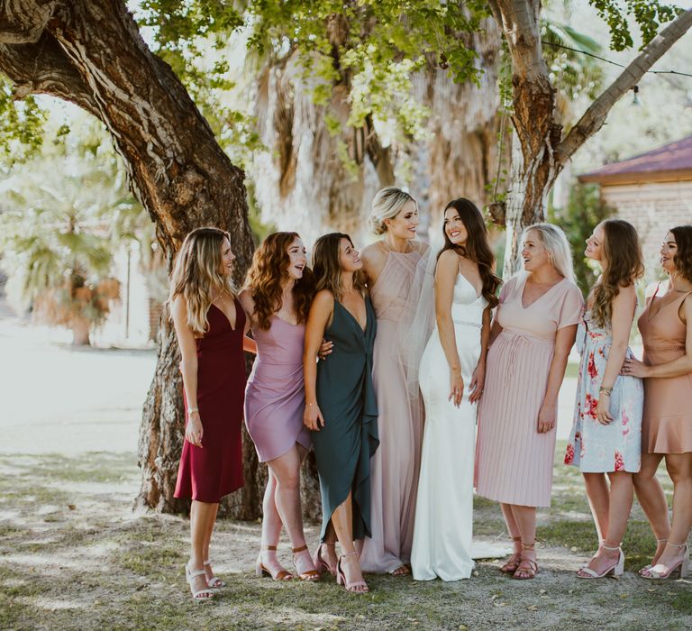 Bride and her besties posing after Mexico wedding ceremony