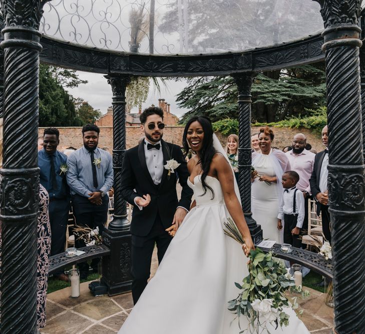 Stylish bride and groom at black tie wedding 