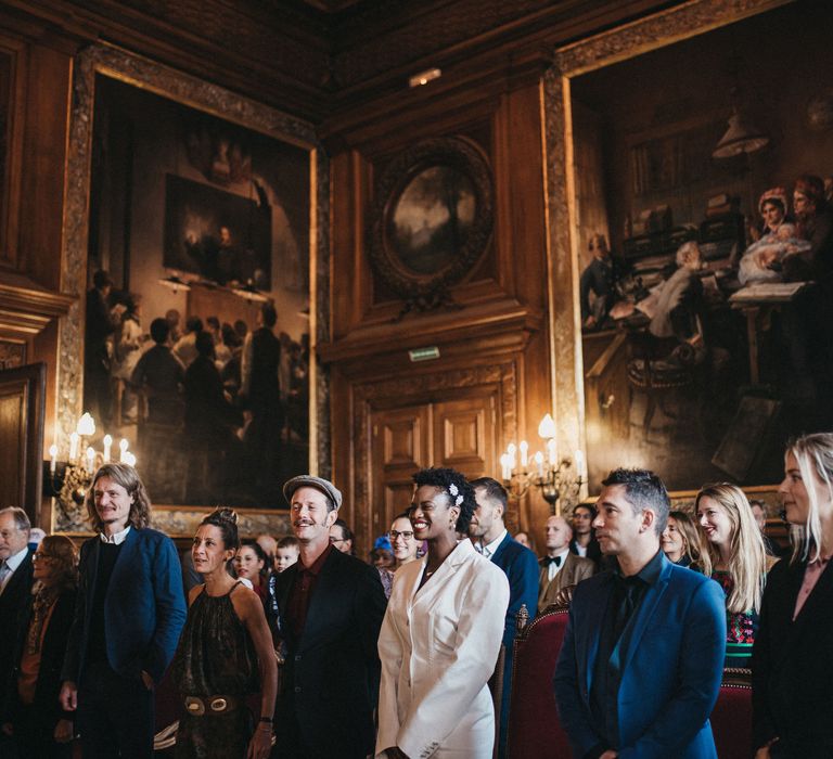 Bride and groom and guests at French town hall wedding ceremony 