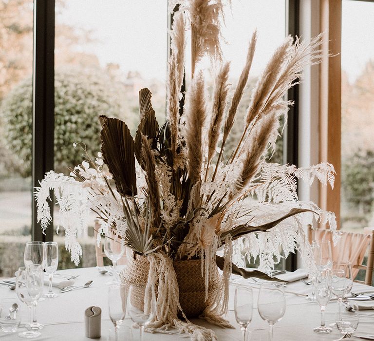 Tall dried pampas grass centrepiece in wicker basket 