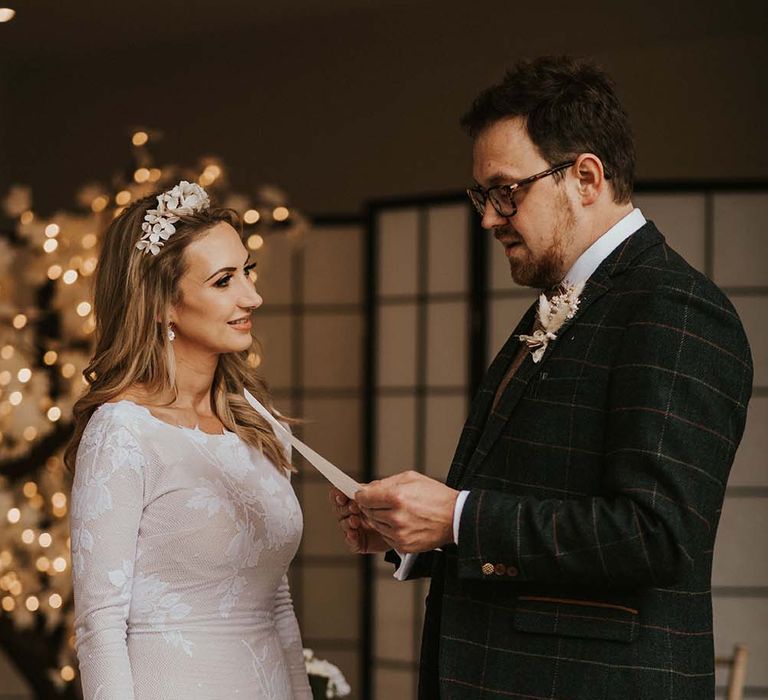 Bride and groom exchanging vows at seaside elopement 