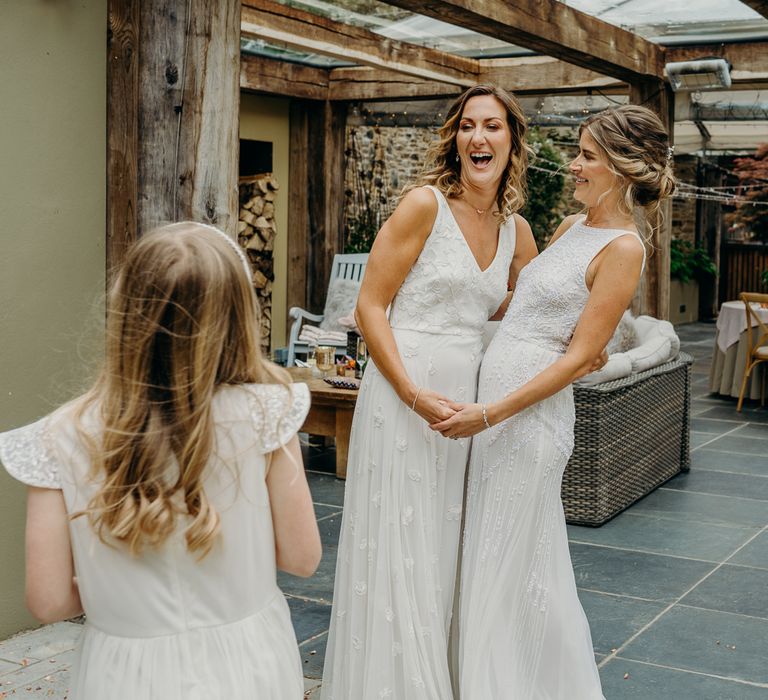 Brides laugh together at Ever After wedding venue