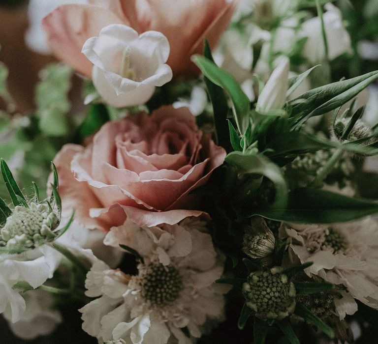 Close up of pink rose, white and green bridal bouquet for Surrey summer wedding