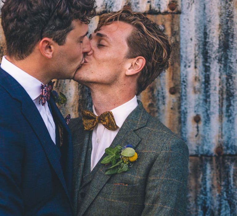 Grooms kiss on their wedding day  | Story + Colour