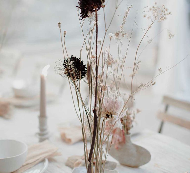 dried wedding flower stems in ceramic finger bowls 