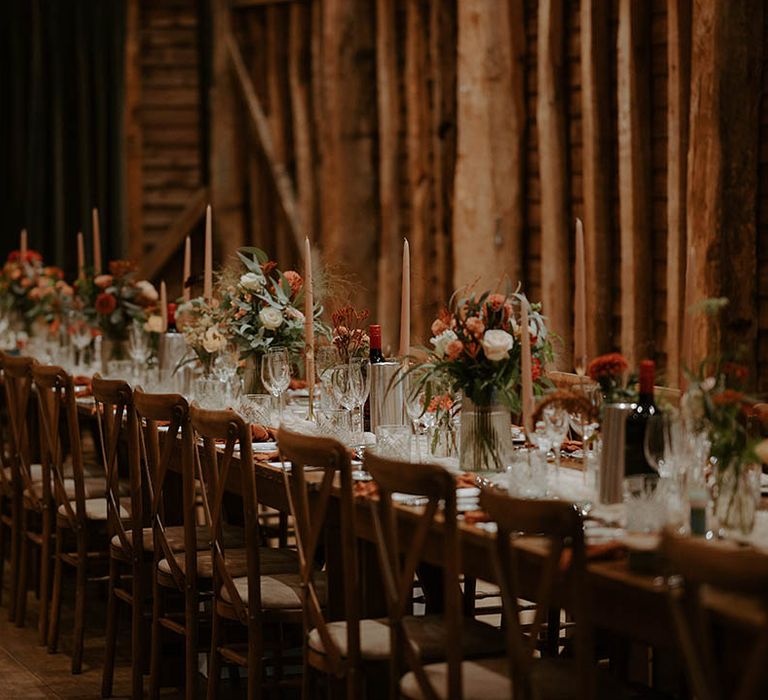 Rustic autumn wedding with flower decor and long wooden tables