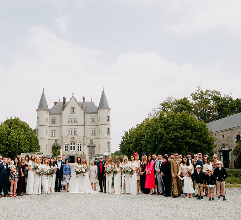 Entire wedding party get a photo together for lgbtqi+ wedding at the chateau 