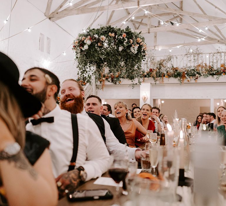 Wyresdale Park wedding in Lancashire with the wedding guests all laughing at the wedding speeches 